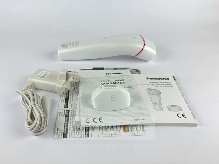 Photo of the Panasonic ES-WH90 box contents laid out on a white background.
