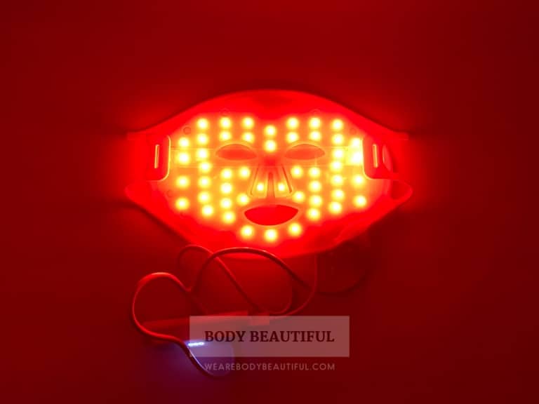 Photo taken of the CurrentBody.com Skin mask in darkness so the red LED lights shine bright